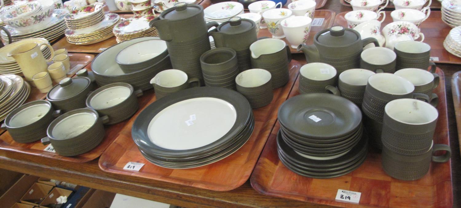 Three trays of Denby stoneware items to include; cups, saucers, coffee/teapots, milk jugs, two