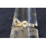 18ct white gold diamond solitaire ring with baguette diamond shoulders. Ring size S, approx weight
