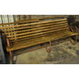 Large wrought iron garden bench with oak slats. (B.P. 21% + VAT)