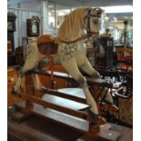 Early 20th Century dapple grey child's rocking horse with saddle and harness, natural mane and