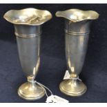 Pair of loaded silver pedestal vases with flared necks on circular stepped bases. Birmingham