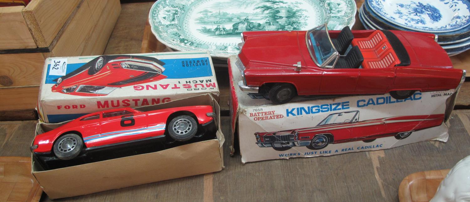 Model Ford Capri car in a Mustang Mach 1 box, together with a king size Cadillac metal made