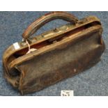 Small leather gladstone type bag with leather handle containing note 'used by a Caerphilly urban