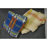 Box containing two vintage blankets, one woollen check fringed blanket and another multi-colour