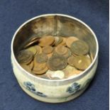 Small circular tin of assorted mainly British copper coins. (B.P. 21% + VAT)