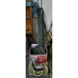 Assorted fishing tackle, rods, parasol, nets, fixed spool reels etc, together with a canvas bag of