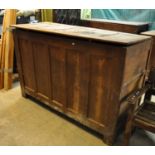 18th Century coffer of deep form with five fielded panels to the front standing on square legs. (B.