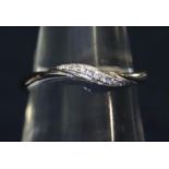 9ct white gold diamond set wave band. RIng size M. Weight 2 grams. (B.P. 21% + VAT)