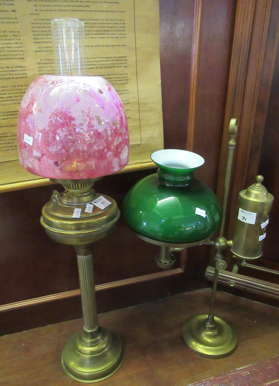 Early 20th century double oil burner having a clear glass chimney, ruby coloured glass shade,