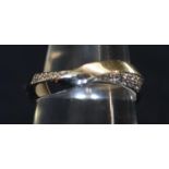 9ct white gold diamond set wave band. Ring size N. Weight 4.4 grams (B.P. 21% + VAT)