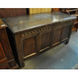 18th Century oak coffer, having moulded top above a carved arched frieze with four fielded blind