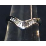 Platinum diamond set wishbone ring set with baguette diamonds. Estimated total diamond weight 0.