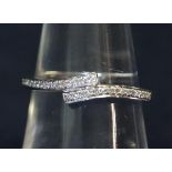 9ct white gold diamond set twist ring. Ring size N. Weight approx 1.7 grams. (B.P. 21% + VAT)