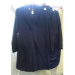 A small collection of early 20th clothing to include; two black wool vintage tailcoats, a pair of