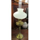 Early 20th century double oil burner with an opaline glass shade, standing on a brass base. (B.P.