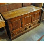 18th Century oak coffer, now converted to a cupboard, decorated with inlaid geometric designs. (B.P.