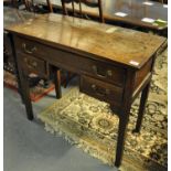 Early 19th Century oak lowboy, the moulded top above one long and two short drawers with brass