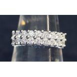 18ct gold two row diamond ring of 18 brilliant cut diamonds. Estimated total diamond weight 1ct.