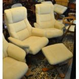 A pair of modern cream upholstered reclining swivel armchairs with matching stool. (3) (B.P. 21% +