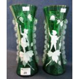 A pair of Victorian green glass Mary Gregory style vases of waisted form with figures and foliage.