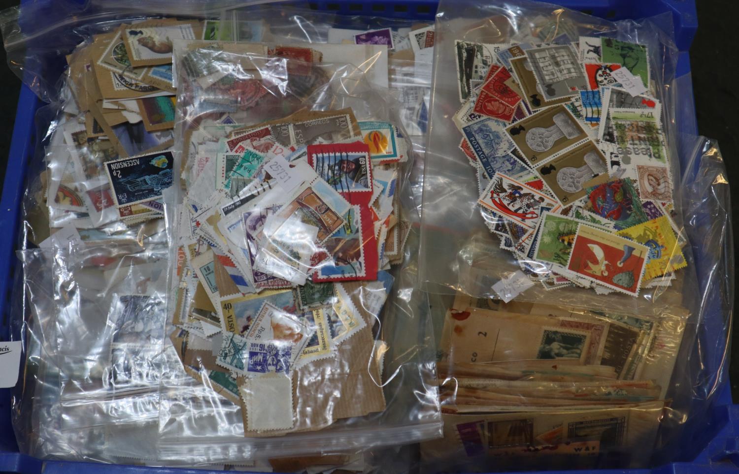 Blue tray with all world selection of stamps in large quantity of plastic packets. 1000's of stamps.