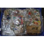 Blue tray with all world selection of stamps in large quantity of plastic packets. 1000's of stamps.