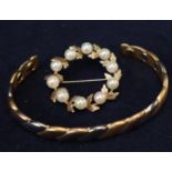 9ct gold cultured pearl circle brooch and a costume jewellery bangle. Weight of brooch approx 5.8