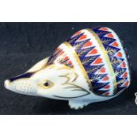Royal Crown Derby bone china paperweight in the form of a hedgehog, with gold stopper to the