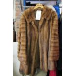A vintage wild mink flared womens coat with rear half belt and horizontal detail to the hem, semi