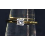 18t gold princess cut diamond solitaire ring. Estimated diamond weight 0.33cts. Ring size M.