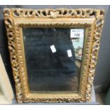 Small pierced foliate framed design mirror. 30 x 36cm approx. (B.P. 21% + VAT)
