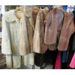 A cream fur swing coat with inner lined cuffs, two fur jackets and a fur stole with collar detail