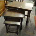 Reproduction stained oak nest of three rectangular tables. (B.P. 21% + VAT)