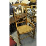 20th Century beech spindle back rocking armchair on cane seat. (B.P. 21% + VAT)