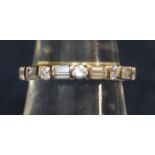 18ct gold and diamond half eternity style ring of baguettes and brilliant cut stones. Ring size O &