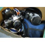 Box of camera equipment to include; an Olympus CM10 camera with flash, a Lumex camera and cases etc.