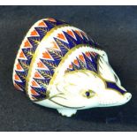 Royal Crown Derby bone china paperweight in the form of a hedgehog, with gold stopper to the