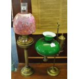 Early 20th century double oil burner having a clear glass chimney, ruby coloured glass shade,