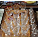 Tray of glasses: six liqueur glasses with engraved grape decoration, eight engraved wine goblets and