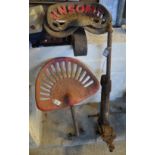 Three vintage cast iron tractor seats marked Ransomes and Bamfords. Together with a cast iron