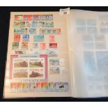All world selection of mostly mint stamps in blue stockbook. 400+ stamps and 20 mini-sheets. (B.P.