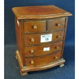 Miniature mahogany serpentine fronted chest of two short and three long drawers, possibly an