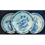 Three early 20th Century Japanese porcelain blue and white chargers decorated with flowers,