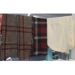 Two antique/vintage woollen blankets, one a plain cream and the other a brown ground check with