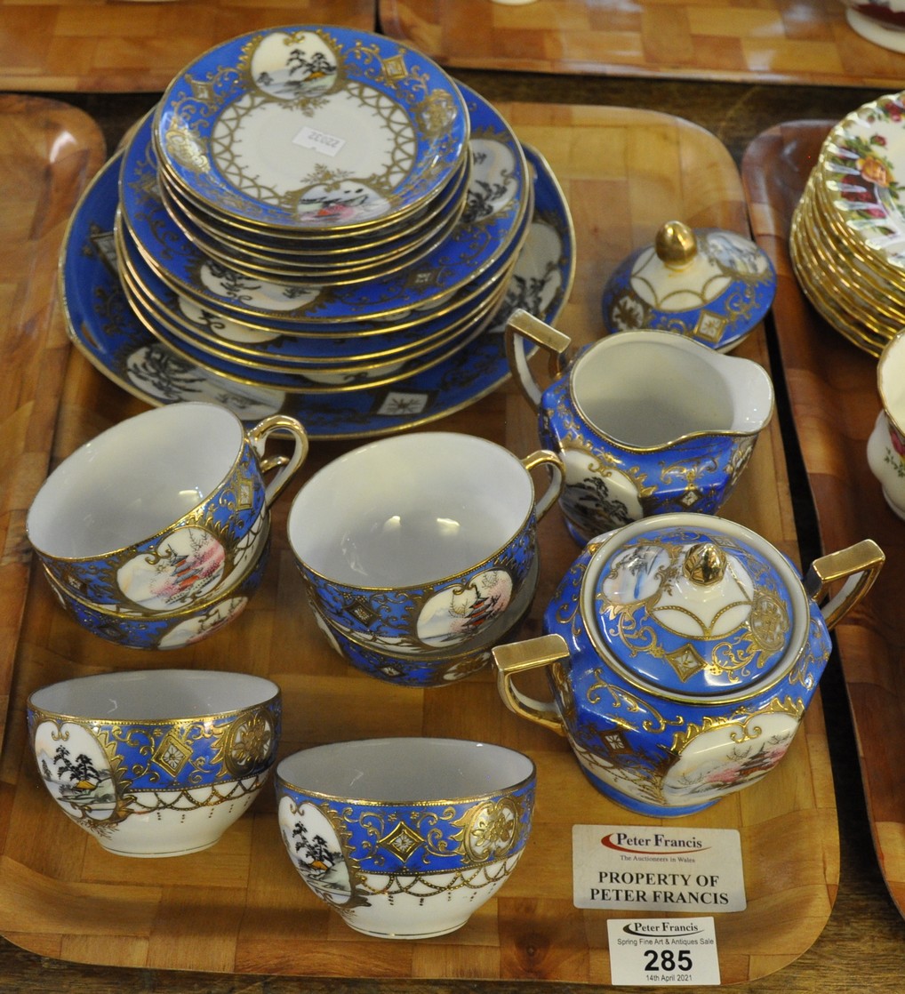 Tray of blue and gilt eggshell porcelain, hand painted, with scenes of pagodas etc., 'Made in Japan'