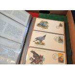 Large box of all world stamps in various stock books and loose and album of World Wildlife Fund