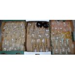 Three boxes of glasses to include; champagne bowls and champagne flutes, wine glasses, pink