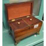 Early 19th Century mahogany sarcophagus shaped two section tea caddy with gilt mounts. (B.P. 21% +