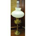 Early 20th century double oil burner with an opaline glass shade, standing on a brass base. (B.P.