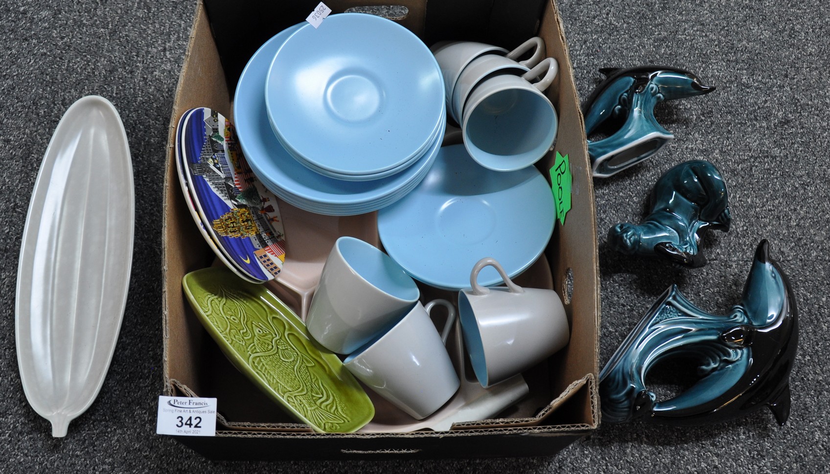 Small box of Poole pottery to include: blue cups, saucers and plates, three Poole ornaments: two